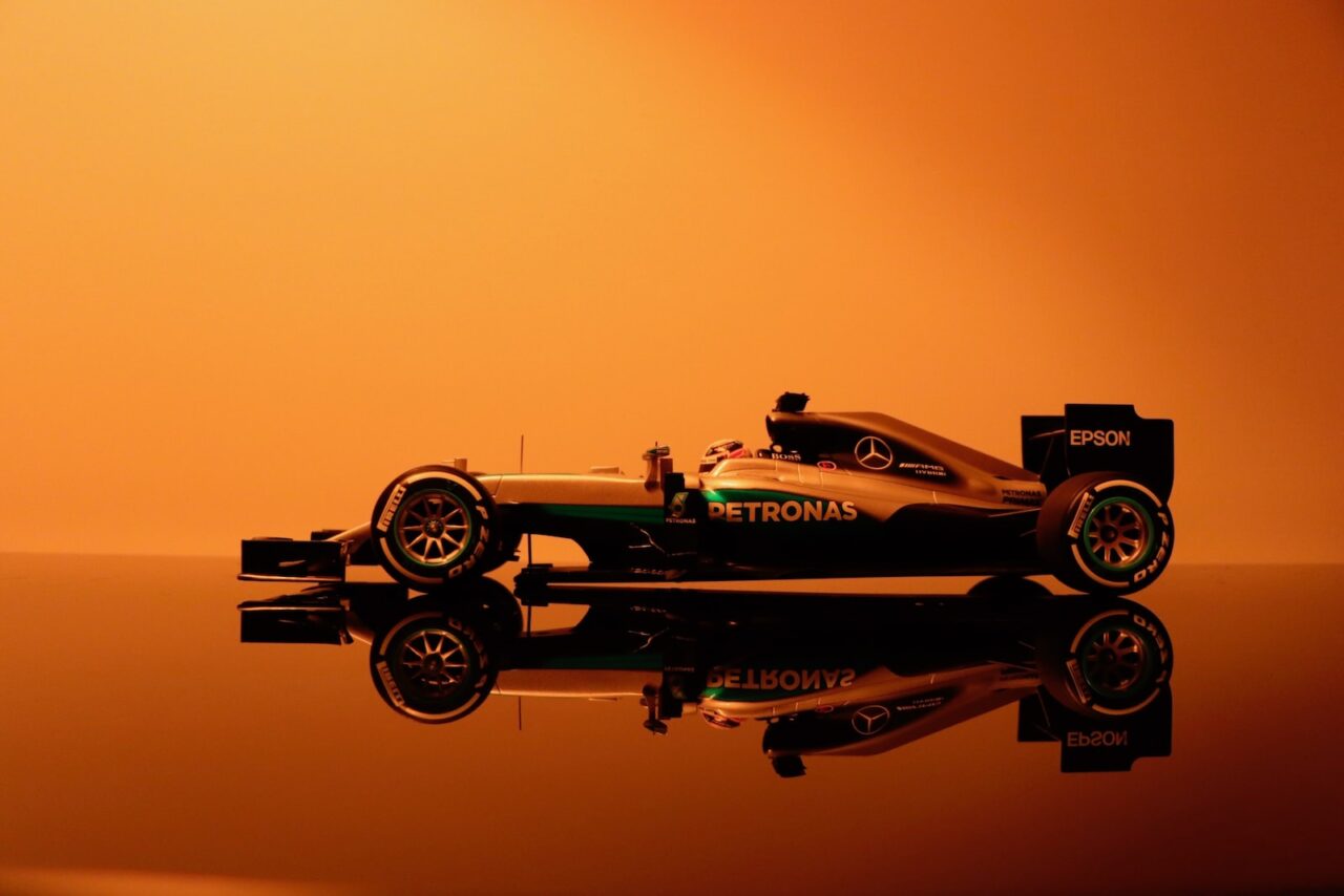 yellow and black Petronas formula 1 car
